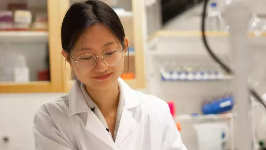 Dr Fengyi Zhu working in a lab