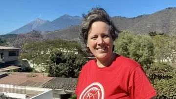 Professor Tamsin Mather standing and smiling outdoors