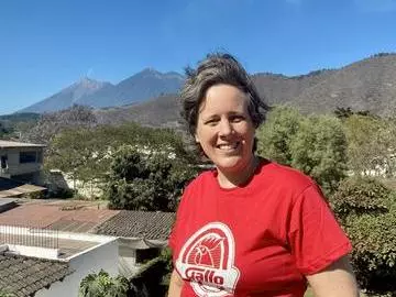 Professor Tamsin Mather standing and smiling outdoors